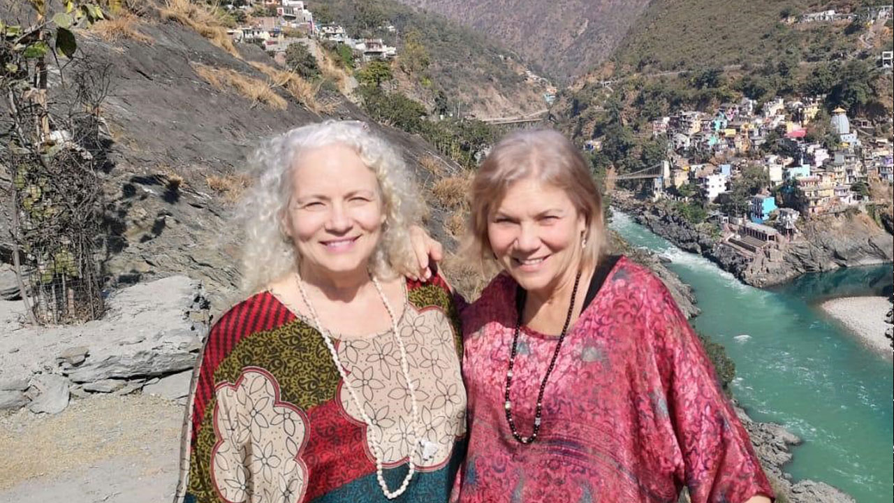 Donna and Millie traveling to sacred sites around the world like the mouth of the Ganges India